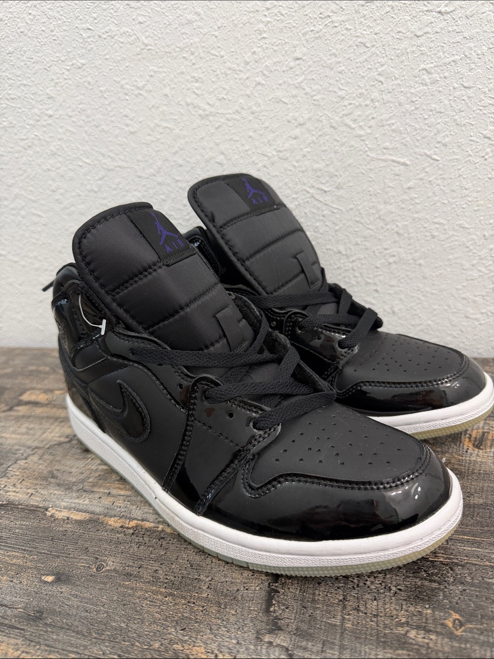 Jordan Black Patent Leather High-Top Sneakers with Purple Logo